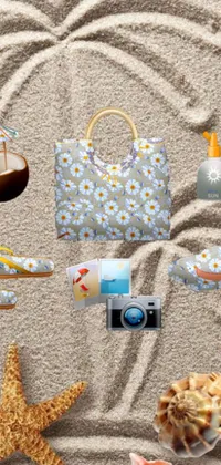 This live wallpaper features a scenic sandy beach with various items scattered around