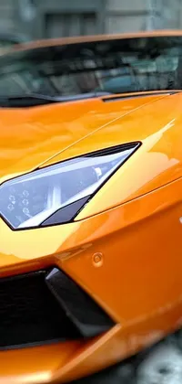 Get ready to turn heads with our new phone live wallpaper! This hyper-realistic image showcases an orange sports car parked in front of a modern building