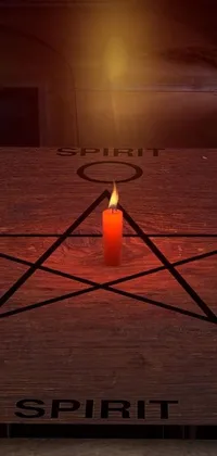 This phone live wallpaper features a wooden table with a candle standing on it, illuminating a digital art image of a summoning ritual