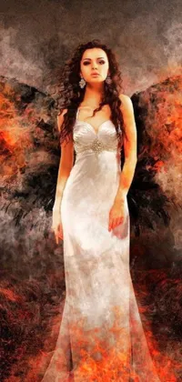 This dynamic phone live wallpaper showcases a stunning digital art scene of a woman in flowing white attire standing in a vast field, with fiery wings spreading out behind her, and the great door of hell in the background