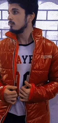 The Live Wallpaper features a man wearing an orange reflective puffer jacket and wielding a baseball bat