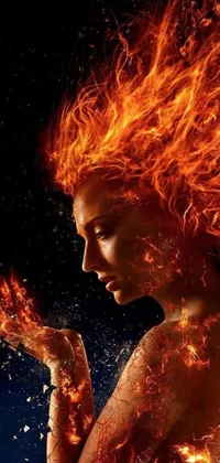 This phone live wallpaper features a fierce woman with fire emanating from her body, perfect for fans of the fantasy genre