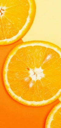 This stunning phone live wallpaper showcases a group of delicious orange slices artistically arranged on a table