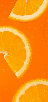 This phone wallpaper showcases a group of orange slices in a vibrant and refreshing aesthetic