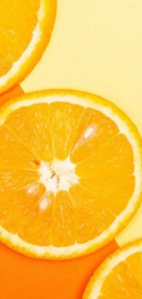 This live wallpaper for your phone showcases a group of orange slices placed on a table