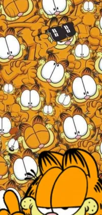 This phone live wallpaper features an adorable cartoon cat perched atop a pile of feline friends
