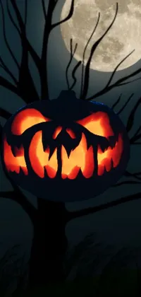 This phone live wallpaper depicts a Halloween pumpkin carved into a tree with a haunting full moon background