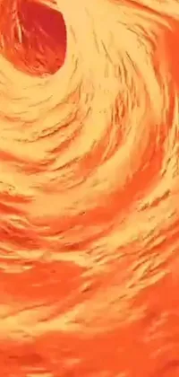 This live wallpaper depicts a dynamic scene of a surfer riding a massive wave