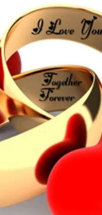 This phone live wallpaper features two gold wedding rings intertwined beside a red heart