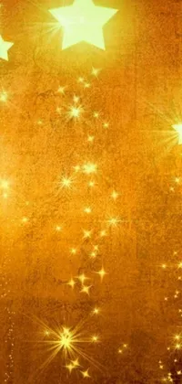 This lively smartphone wallpaper showcases a group of stars suspended on a string in an upper echelon background of golden hues and floating in a divine light
