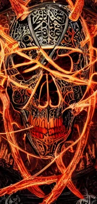 This stunning live phone wallpaper depicts a vibrant orange skull with fiery flames emitting from it
