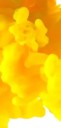 This phone live wallpaper showcases yellow ink in water in a stunning close-up view, creating a mesmerizing abstract claymation effect