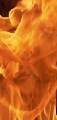 This phone live wallpaper showcases a highly detailed close-up of a blazing fire with intense flames in 8k resolution