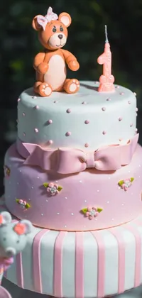 This live wallpaper features a charming pink and white cake with a cute teddy bear on top