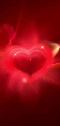 Introduce a stunning heart live wallpaper for your phone, featuring a vivid red background and a mesmerizing close-up of a pulsating heart