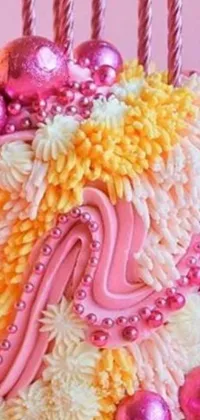 This phone live wallpaper features a close-up of a colorful birthday cake with flickering candles, surrounded by pink jellyfish and vibrant waves of pasta