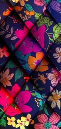 This stunning phone live wallpaper boasts a floral pattern with bright and vibrant hues set against a cool blue backdrop