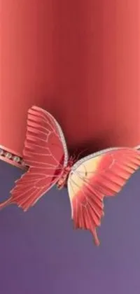 Decorate your phone with a stunning live wallpaper featuring a cell phone with a butterfly on it