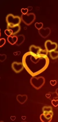 This lively live wallpaper features colorful hearts floating in the air against a beautiful red and orange background, with a subtle golden glow pulsing around them