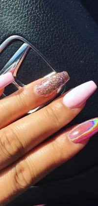 This stunning phone live wallpaper features a close-up of a hand with radiant pink manicured nails