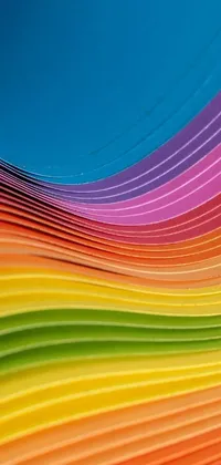 This phone live wallpaper showcases a unique and colorful pattern of stacked papers