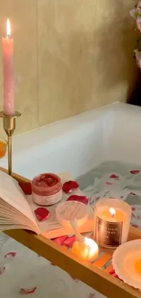 Bring a serene and cozy ambiance to your phone with this bath tub filled with candles and a book live wallpaper
