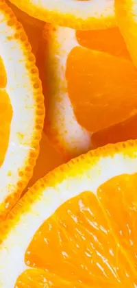 Get ready to add some zest to your phone with this vibrant phone live wallpaper! Featuring a close-up of juicy orange slices, this wallpaper is perfect for anyone who loves bright, colorful designs