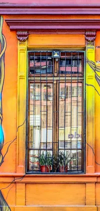 This dynamic phone live wallpaper showcases an awe-inspiring painting of graffiti art nestled on the side of an exquisite building