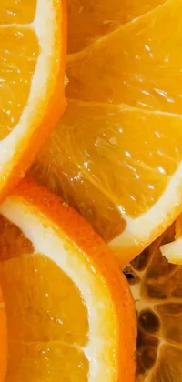 This phone live wallpaper depicts a pile of orange slices with ultra-detailed close-up quality