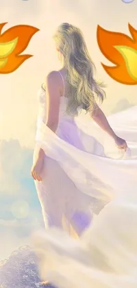This live phone wallpaper depicts a woman in a white dress standing on a rock in a dreamlike environment