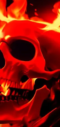 This phone live wallpaper features a digitally rendered, highly detailed skull with flames in the background
