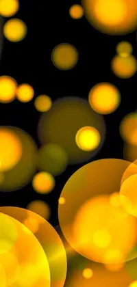 This digital art live wallpaper features playful yellow circles and lanterns on a black background