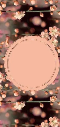 This phone live wallpaper boasts a circular frame set amid an array of delicate pink flowers, perfect for those who admire sōsaku hanga design
