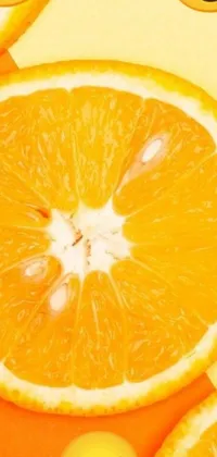 This live wallpaper features a close-up shot of orange slices with various emoticons on them on an orange halter top background captured by Gavin Hamilton
