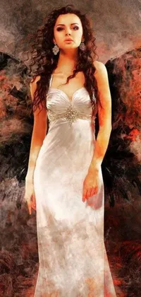 This stunning live wallpaper features a beautiful woman wearing a white dress standing in front of a flickering fire