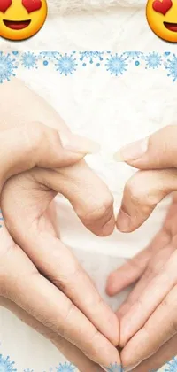 Looking for a stunning phone live wallpaper? Look no further! This beautiful live wallpaper features two anonymous people holding hands and forming a heart shape between them, set against a serene background of gently falling snowflakes