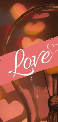 This stunning live wallpaper for your phone displays a beautifully illustrated light bulb with the word "love" inscribed on it