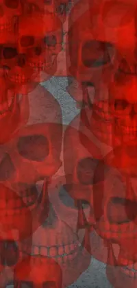 This phone live wallpaper showcases a digital art design of a group of skulls sitting beside each other