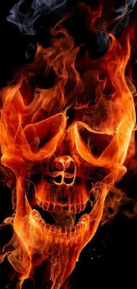 This phone live wallpaper features a Gothic-inspired flaming skull design on a black background