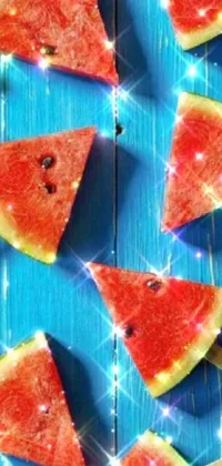 Looking for a fun and playful live wallpaper for your phone? Check out this digital rendering of watermelon slices on a stick! This wallpaper features realistic and juicy-looking watermelon slices arranged in a neat pattern on a geometric backdrop