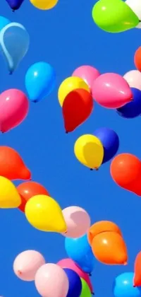 Enjoy a cheerful live wallpaper on your phone - colorful balloons floating in the air against a clear blue sky with no clouds