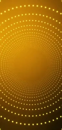 This live phone wallpaper is a stunning display of generative art, featuring a yellow background adorned with circles and dots arranged in a symmetrical pattern