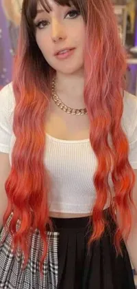 This live phone wallpaper features a vibrant colorized close-up of a person boasting long wavy orange hair