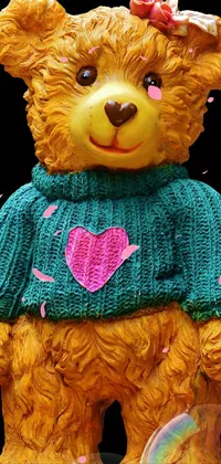 Explore a delightful live wallpaper for your phone showcasing an adorable teddy bear wearing a cozy sweater