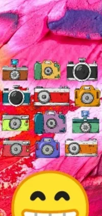 This live phone wallpaper features a smiley face surrounded by cameras capturing images in 16 bright and colorful hues