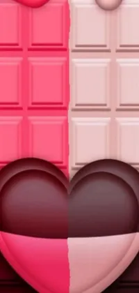 This phone wallpaper features two heart-shaped chocolate bars facing each other