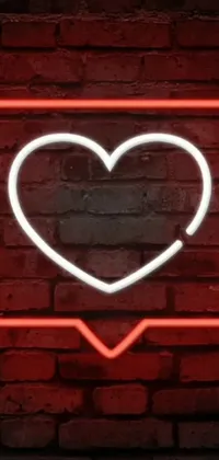 This live wallpaper features a stunning heart-shaped neon sign on a brick wall, adorned with graffiti and a dating app icon