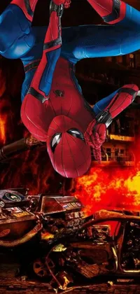 Get the ultimate superhero wallpaper for your phone with this amazing live wallpaper featuring Spider-Man! Watch as the iconic character swings through the air, flying in front of a massive fire