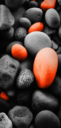 This captivating phone live wallpaper showcases a stunning cluster of rocks in orange and black tones