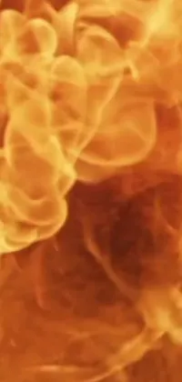 This phone live wallpaper features a stunning close-up of a blazing fire with realistic smoke effects